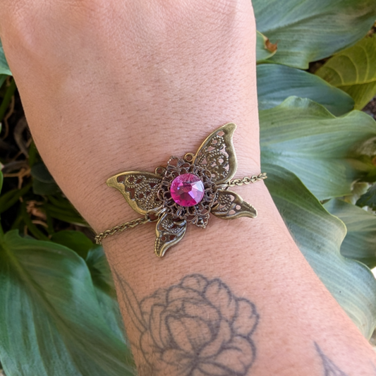 Fuchsia Crystal Filigree Butterfly Bracelet in Brass with Acorn Bead Charm